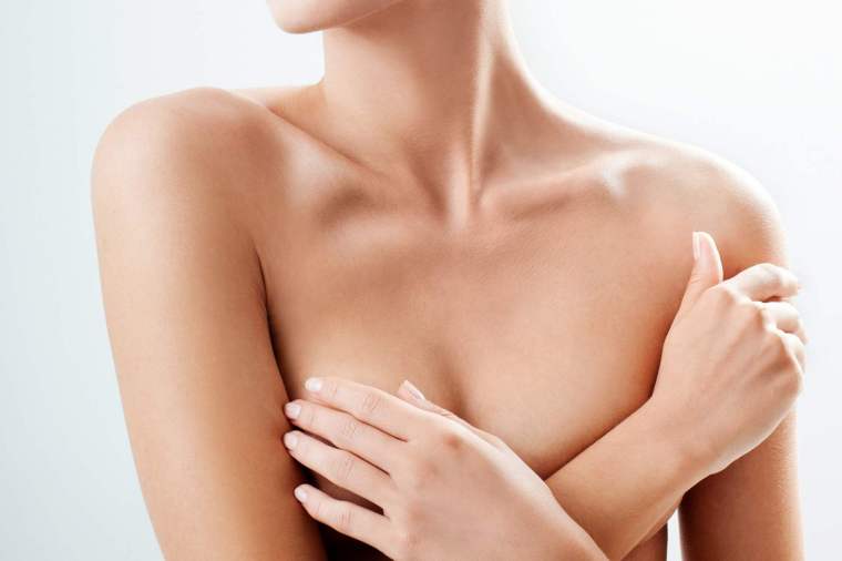 Breast lift (mastopexy) procedure to correct sagging breasts – natural and lifted results by Dr. Hakki Izmirli